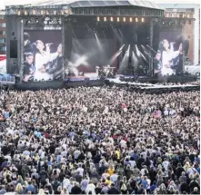  ??  ?? STANDING TOGETHER The 55,000-strong crowd at Old Trafford Cricket Ground watch Ariana Grande performing during the One Love Manchester benefit concert