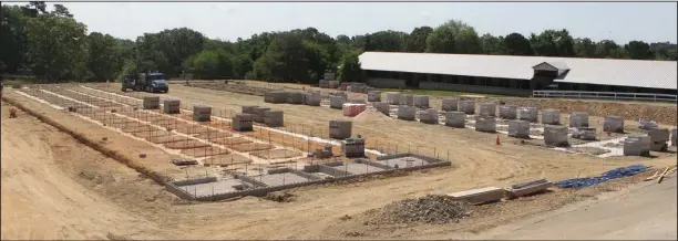  ?? The Sentinel-Record/Richard Rasmussen ?? GROUNDWORK: Constructi­on was underway Friday on two new barns in the stable area at Oaklawn Park. The track plans to complete three new barns by the time horses arrive in November.