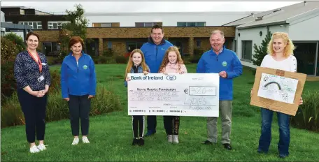  ??  ?? Two young ladies Lydia Leader and Mellisa O’Connor, both from Kilcummin, Killarney, presents a cheque Lydias’s Fundraiser for €320 proceeds of a car boot sale in Kilcummin, Village, Killarney, for The Palliative Care Unit at University Hospital Kerry and are picture at Palliative Care Unit at UHK on Friday with Lydia’s parents showing their advertisin­g poster, from left Mari O’Connell, Director of Nursing at Palliative Care Unit at UHK, Mary Shanahan Sec, Kerry Hospice Foundation. Mellisa O’Connor, Anthony Leader and his daughter Lydia Leader, Joe Hennebery, Chairman Kerry Hospice, Foundation and Carmel Leader. Pic. johncleary­photo.com