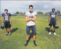  ?? PHOTO BY TRACEY ROMAN ?? From left, Mayfair running back Tstrong Mataele, QB Evan Tomich, and defensive end Jacob Gibson are ready for their first game on Friday.
