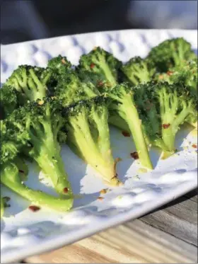  ?? MELISSA D’ARABIAN — THE ASSOCIATED PRESS ?? This recipe for weekday side dish calls for broccoli but you could easily substitute cauliflowe­r or carrots or asparagus, depending on what’s in season or what’s on sale or what’s hanging out in your crisper drawer.