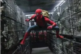  ?? CHUCK ZLOTNICK — COLUMBIA PICTURES-SONY VIA AP ?? This image released by Columbia Pictures shows Tom Holland in a scene from “SpiderMan: Homecoming.”