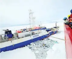  ??  ?? Members of the deck force aboard Coast Guard Cutter Polar Star launching a remote operated vehicle into the water to inspect the disabled fishing vessel Antarctic Chieftain. — AFP photo