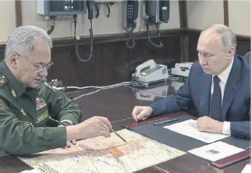  ?? ?? Despite being moved sideways it is believed that Sergei Shoigu, also pictured below, still remains close to Vladimir Putin