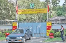  ??  ?? A car leaves the residence of Aung San Suu Kyi in Yangon a day after a surgical coup that saw Suu Kyi detained.