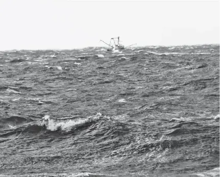  ?? ASHLEY THOMPSON • SALTWIRE NETWORK ?? A vessel bobs through Bay of Fundy waters off of the coast of Hillsburn, Annapolis County while search efforts continue for crew members of the Chief William Saulis.