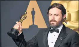  ??  ?? Leonardo di Caprio presented Emma Stone with her Oscar as best female lead in La La Land, while Casey Affleck was leading man for Manchester by the Sea