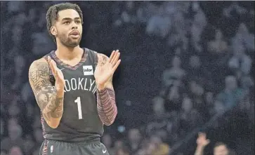  ?? Mary Altaffer Associated Press ?? D’ANGELO RUSSELL is averaging career highs of 20.3 points and 6.6 assists as the Nets go for a playoff spot.