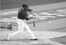  ?? GREGORY BULL AP ?? Tampa Bay’s Manuel Margot hits a two-run home run to score Ji-Man Choi in the third inning on Tuesday night at Petco Park.