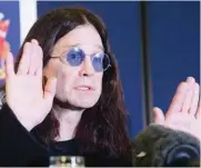  ??  ?? In this file photo British rock star Ozzy Osbourne gestures during a Thames Valley Police press conference in Gerrards Cross, Britain, after his house was broken into late 22 November.