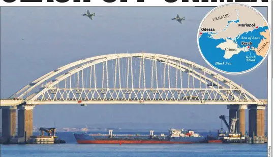  ??  ?? TENSE: Russian jets fly over a bridge linking Russia to the Crimean Peninsula on Sunday after three Ukrainian navy ships were stopped by the Kremlin.