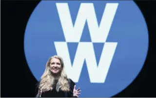  ?? AMY SUSSMAN/AP IMAGES FORWEIGHT WATCHERS, FILE ?? FILE- In this Feb. 7, 2018, file image distribute­d for Weight Watchers, Weight Watchers President and Chief Executive Officer Mindy Grossman speaks at a global employee event in New York. Weight Watchers is trimming its name to just two letters: WW. The company says it is renaming itself to focus more on overall wellness and not just dieting.