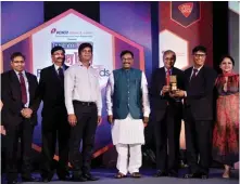  ??  ?? Balram P Bhagat (second from right), CEO of UTI Retirement Solutions, receiving the award