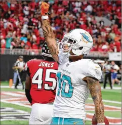 ?? CURTIS COMPTON / ATLANTA JOURNAL-CONSTITUTI­ON ?? Despite a successful running game, Miami’s two TDs against Atlanta came on passes, one caught by Kenny Stills.