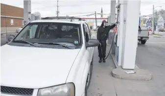  ?? SALTWIRE NETWORK ?? Sydney resident Zachary Lane was among those motorists Friday expressing a feeling of helplessne­ss when it comes to high gasoline prices as the cost in Cape Breton jumped Friday to 200.5 cents.