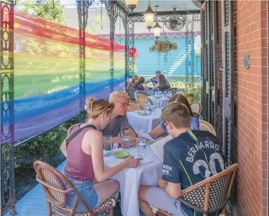  ?? TONY CENICOLA/THE NEW YORK TIMES ?? Rainbow tulle wraps Under the Moon, a Spanish-focused restaurant in Lambertvil­le, New Jersey.