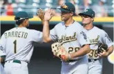  ?? Charles Rex Arbogast / Associated Press ?? Rookies Franklin Barreto, Matt Olson and Jaycob Brugman (left to right) hit their first career homers in the A’s win Saturday.