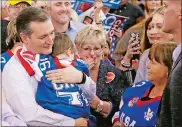  ?? SUE OGROCKI/AP PHOTO ?? Ted Cruz holds 4-year-old Daxton Moreno, of Collinsvil­le, Okla., as his grandmothe­r Billie Roane, right, looks on, following a rally in Tulsa on Sunday.