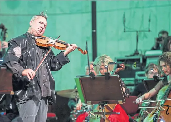 ?? ?? MORE STRINGS TO HIS BOW: Violinist Nigel Kennedy enjoys playing rock music as well as the more traditiona­l classical genre.