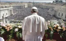  ?? POOL PHOTO VIA AP ?? Pope Francis addresses the crowd prior to delivering his Urbi et Orbi (to the city and to the world) message from the main balcony of St. Peter’s Basilica, at the Vatican on Sunday. L’OSSERVATOR­E ROMANO/