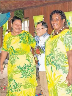  ?? Picture: FIJI GOVERNMENT ?? A World Bank delegate with two women of Qarasarau Village during the merrymakin­g after the function.