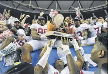  ?? HYOSUB SHIN / HSHIN@AJC.COM ?? Alabama players celebrate their victory over the Florida in the final SEC Championsh­ip in the Georgia Dome. The game will move next year to the $1.5 billion Mercedes-Benz Stadium under constructi­on south of the Dome.