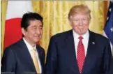  ?? PABLO MARTINEZ MONSIVAIS — THE ASSOCIATED PRESS FILE ?? U.S. President Donald Trump and Japanese Prime Minister Shinzo Abe stand on stage together at the conclusion of their joint news conference in the East Room of the White House in Washington.