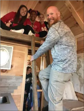  ?? LAURA CATALANO — FOR DIGITAL FIRST MEDIA ?? Teacher Bill Crowl climbs a ladder to the cozy loft area, where STEAM club members Capri Norris, Cameron Cooper and Nico Mancuso are seated.