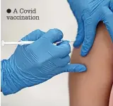  ?? ?? ● A Covid vaccinatio­n