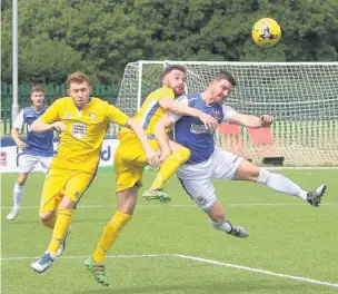  ?? BERNIE FORD ?? Penybont’s Gethin Jones challenges for the ball