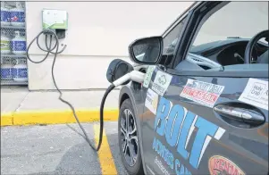  ?? NIKKI SULLIVAN/CAPE BRETON POST ?? The Bolt charges at a level 2 charger at the Ultramar at the Membertou Market. It was the only charger Boyd and Hetheringt­on could find on Cape Breton Island.