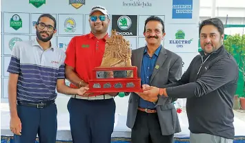  ??  ?? (from left) Profession­al Golf Tour of India Order of Merit leader Karandeep Kochhar, Olympian and defending champion Udayan Mane, Hyderabad Golf Associatio­n president C. Dayakar Reddy and Vooty Golf County general manager Rupinder Singh Gill pose with the Golconda Masters trophy at the Hyderabad Golf Club on Tuesday.