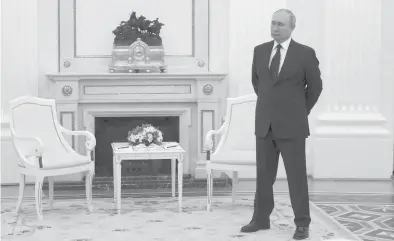  ?? MIKHAIL KLIMENTYEV/SPUTNIK/GETTY-AFP ?? Russian President Vladimir Putin stands Friday before a meeting at the Kremlin in Moscow.