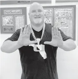  ?? DAVID FURONES/SUN SENTINEL ?? AJ Machado, the Turnover Chain jeweler, shows off his fourth edition of Miami’s chain that highlights all of South Florida.