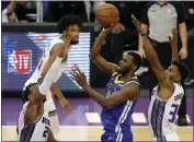  ?? EZRA SHAW — GETTY IMAGES ?? The Warriors’ Andrew Wiggins goes up for a shot against the Kings’ Buddy Hield at Golden 1 Center in Sacramento on Tuesday.