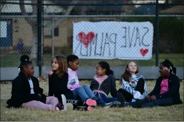  ?? HELEN H. RICHARDSON — THE DENVER POST ?? Students hang out together on the grass outside of Palmer Elementary School on Nov. 9, 2022 after Denver Public Schools made an announceme­nt that they were considerin­g closing schools in the district.