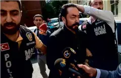  ??  ?? ABOVE: Turkish police officers arrest televangel­ist and cult leader Adnan Oktar on 11 July 2018; he has now been sentenced to more than 1,000 years in prison.