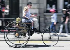  ??  ?? Speedy . . . Labour MP David Clark, and daughter Clara (7), take a ride in a replica 1886 Benz.