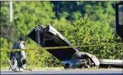  ?? BEN QUEEN / ASSOCIATED PRESS ?? Part of a cargo plane contracted to UPS lies on the ground Friday following a fatal crash at Yeager Airport in Charleston, W.Va. The pilot and co-pilot of the aircraft were killed in the morning crash.