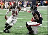  ?? CURTIS COMPTON / CCOMPTON@AJC.COM ?? Julio Jones caught 12 passes for 253 yards and two touchdowns in a 34-20 win over the Buccaneers on Nov. 26.