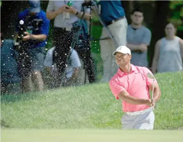  ??  ?? Tiger Woods of the United States hits his third shot on the first hole during the third round of The Memorial Tournament Presented by Nationwide at Muirfield Village Golf Club in Dublin, Ohio. — AFP photo