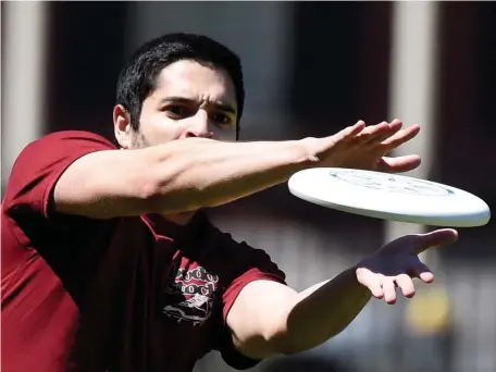  ?? JIM MICHARU PHOTOS / BOSTON HERALD ?? GOT IT! Jake Jevitt, of Boston, catches a Frisbee while enjoying the nice day on the Common on Sunday.