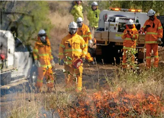  ?? PHOTO: TARA MIKO ?? EARLY WORK: Controlled hazard reduction burns in Toowoomba were brought forward by weeks during an unusually dry and warm winter.