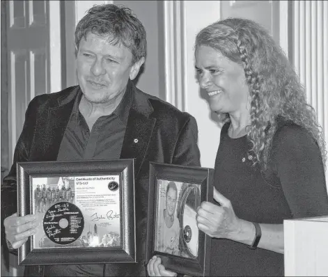 ?? JIM DAY/THE GUARDIAN ?? Island singer-songwriter Lennie Gallant was thrilled to have his framed CD “returned’’ by Gov. Gen. Julie Payette. Payette took the CD, ‘When We Get There’, with her into space aboard the Space Shuttle Endeavour in 2009, playing songs during the mere 10.5-million-kilometre flight.