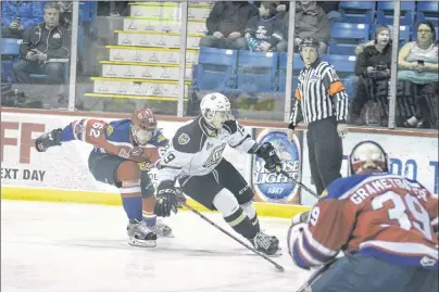  ?? JASON MALLOY/THE GUARDIAN ?? Charlottet­own Islanders’ fans will get to see more of this kind of action over the next four years as the City of Charlottet­own has just signed a four-year deal to keep the team in the capital. In the picture, Islanders forward Cameron Askew makes a...