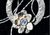  ?? SPECIAL TO THE EXAMINER ?? Bailieboro artist Georgina Brown created this silver pendant, called Ring Around the Posie.