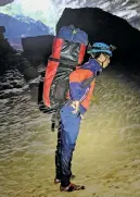  ??  ?? WORKING ENVIRONMEN­T. Vietnamese porter Ho Minh Phuc in Son Doong cave.