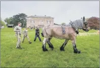  ?? ?? PUSHING FOR VICTORY: Main picture top, troops taking part in a bale challenge during wagon challenge day in the grounds of Sledmere House in East Yorkshire; above left, soldiers trying their hand at long reining; above right, Gurkhas show how to do the Kukri dance.