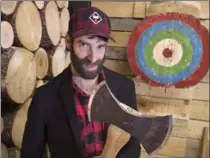  ?? ANDREW VAUGHAN, THE CANADIAN PRESS ?? Darren Hudson operates the Timber Lounge which features axe throwing.