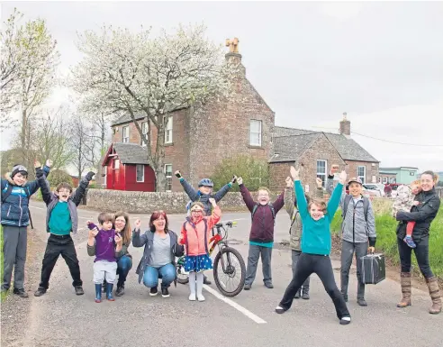  ?? Picture: Paul Reid. ?? Parents and pupils celebrate news of the school’s reprieve at Stracathro yesterday.